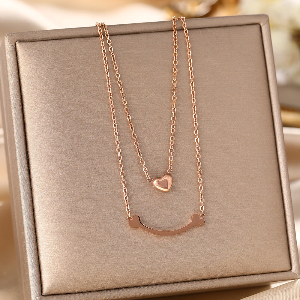 European and American cross-border hot-selling double-layer titanium steel necklace women's peach heart pendant versatile collarbone chain jewelry wholesale does not fade
