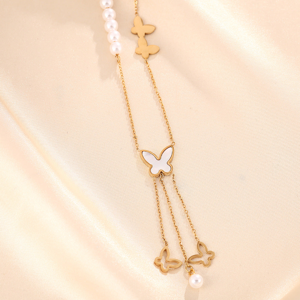 Korean version of white shell butterfly pearl necklace women's titanium steel hollow long fringe pendant fashion collarbone chain jewelry does not fade