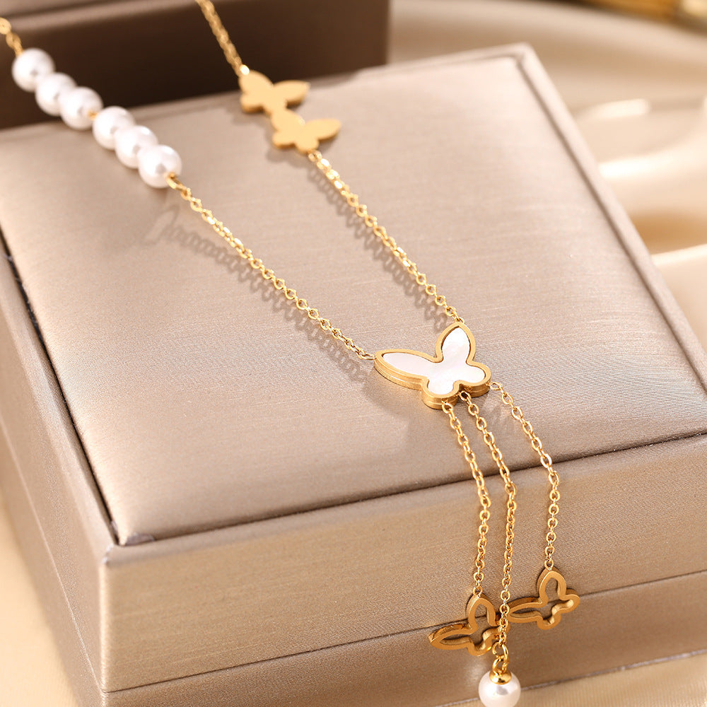Korean version of white shell butterfly pearl necklace women's titanium steel hollow long fringe pendant fashion collarbone chain jewelry does not fade