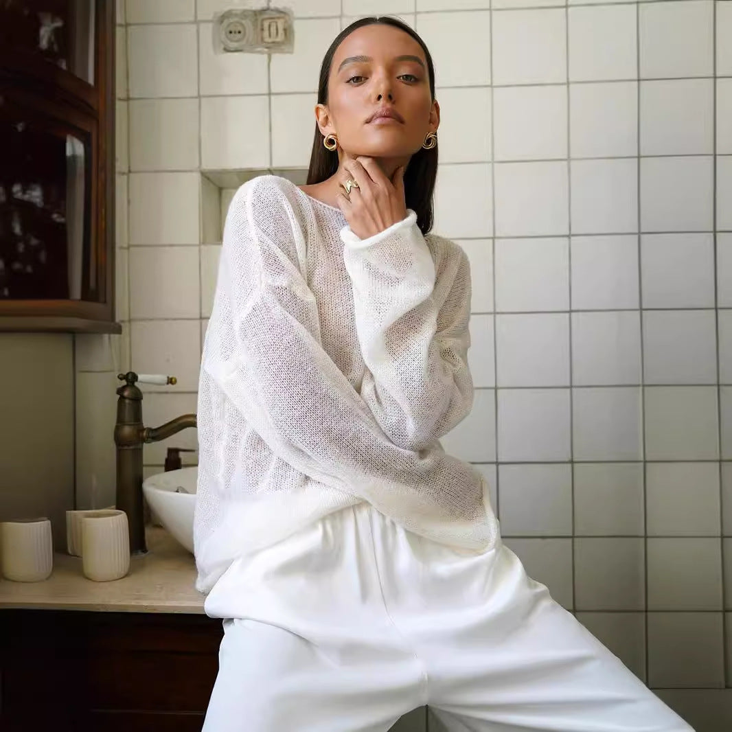 Hollow knitted sweater European, American spring and summer new women's perspective thin large round neck horn sleeve knitted T-shirt