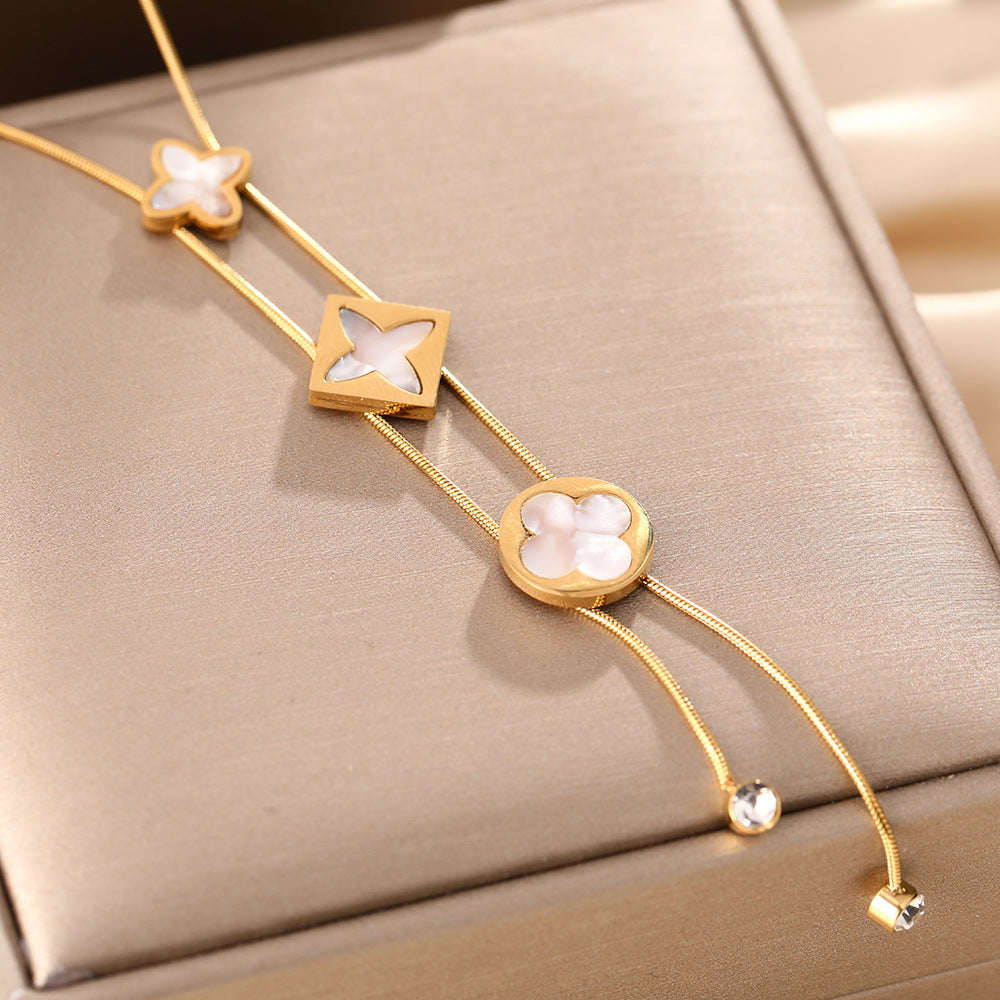 Korean version of the new temperament versatile titanium steel necklace female fringed four-leaf clover white fritillary simple niche collarbone chain jewelry