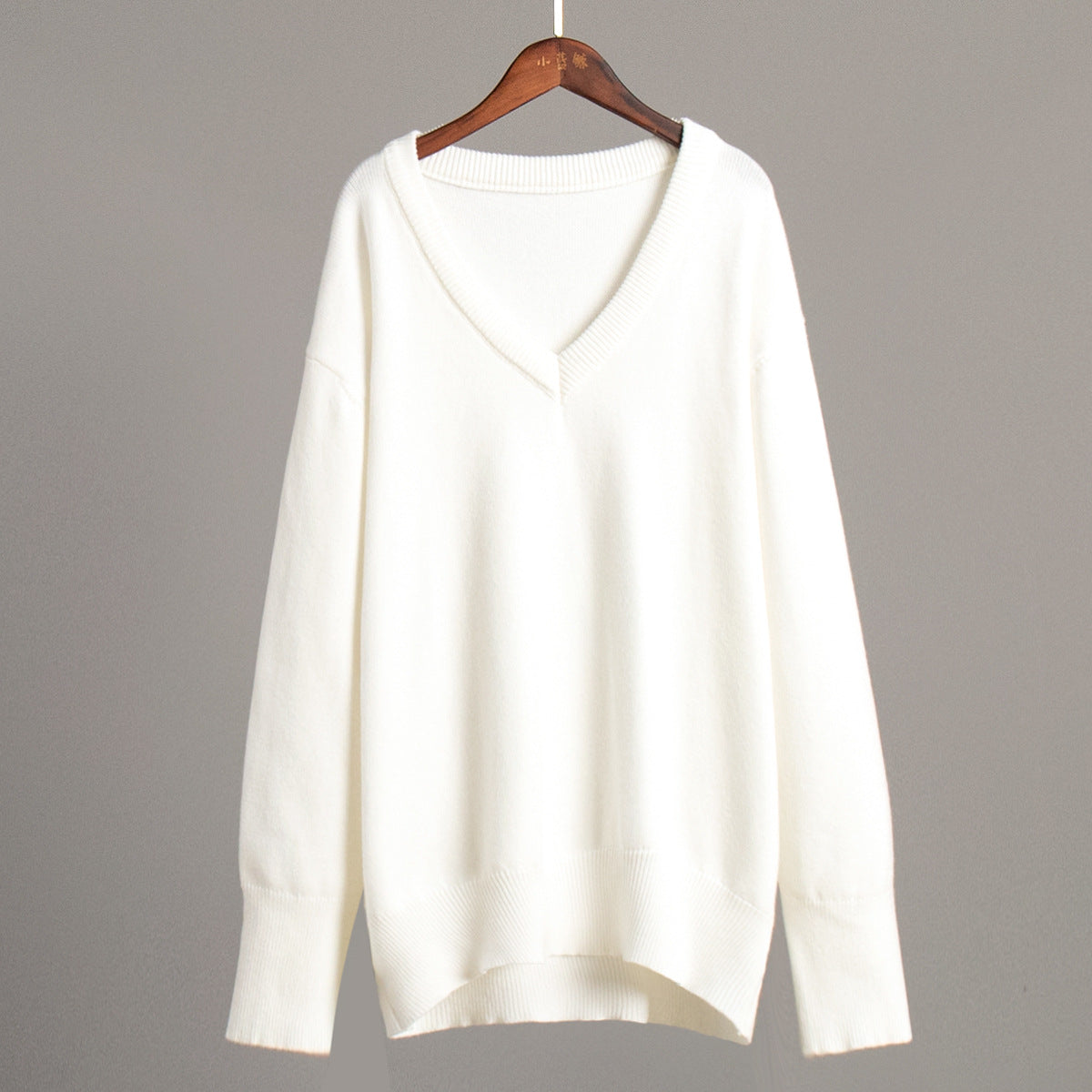 V-neck sweater women's autumn and winter European and American solid color versatile pullover sweater loose knitted sweater
