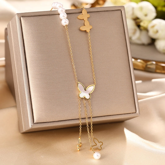 Korean version of white shell butterfly pearl necklace women's titanium steel hollow long fringe pendant fashion collarbone chain jewelry does not fade