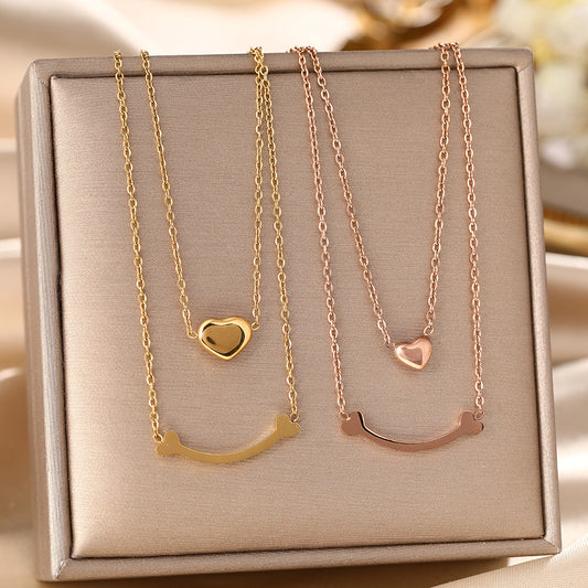 European and American cross-border hot-selling double-layer titanium steel necklace women's peach heart pendant versatile collarbone chain jewelry wholesale does not fade